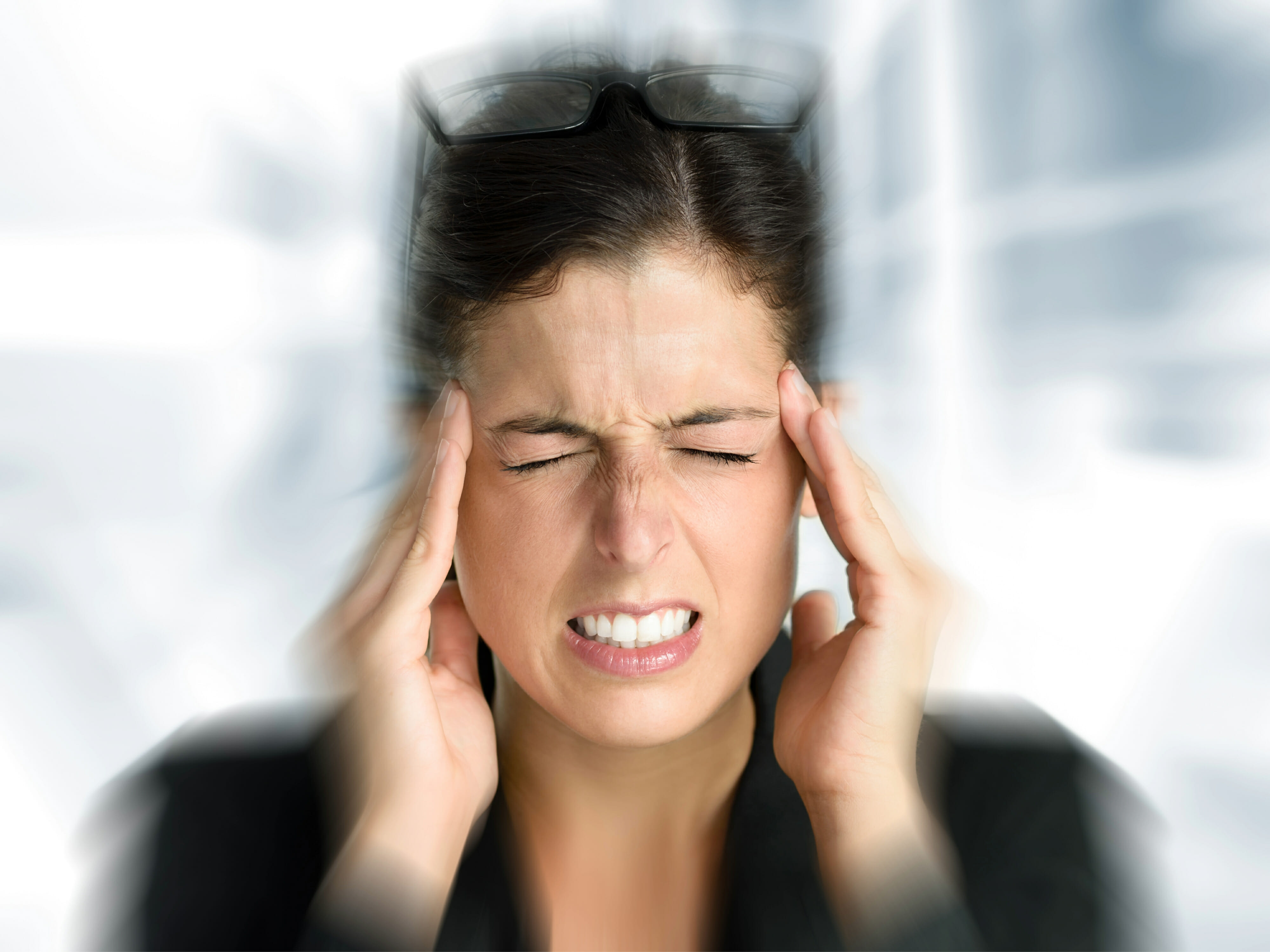 Woman with intense stress and painful headache