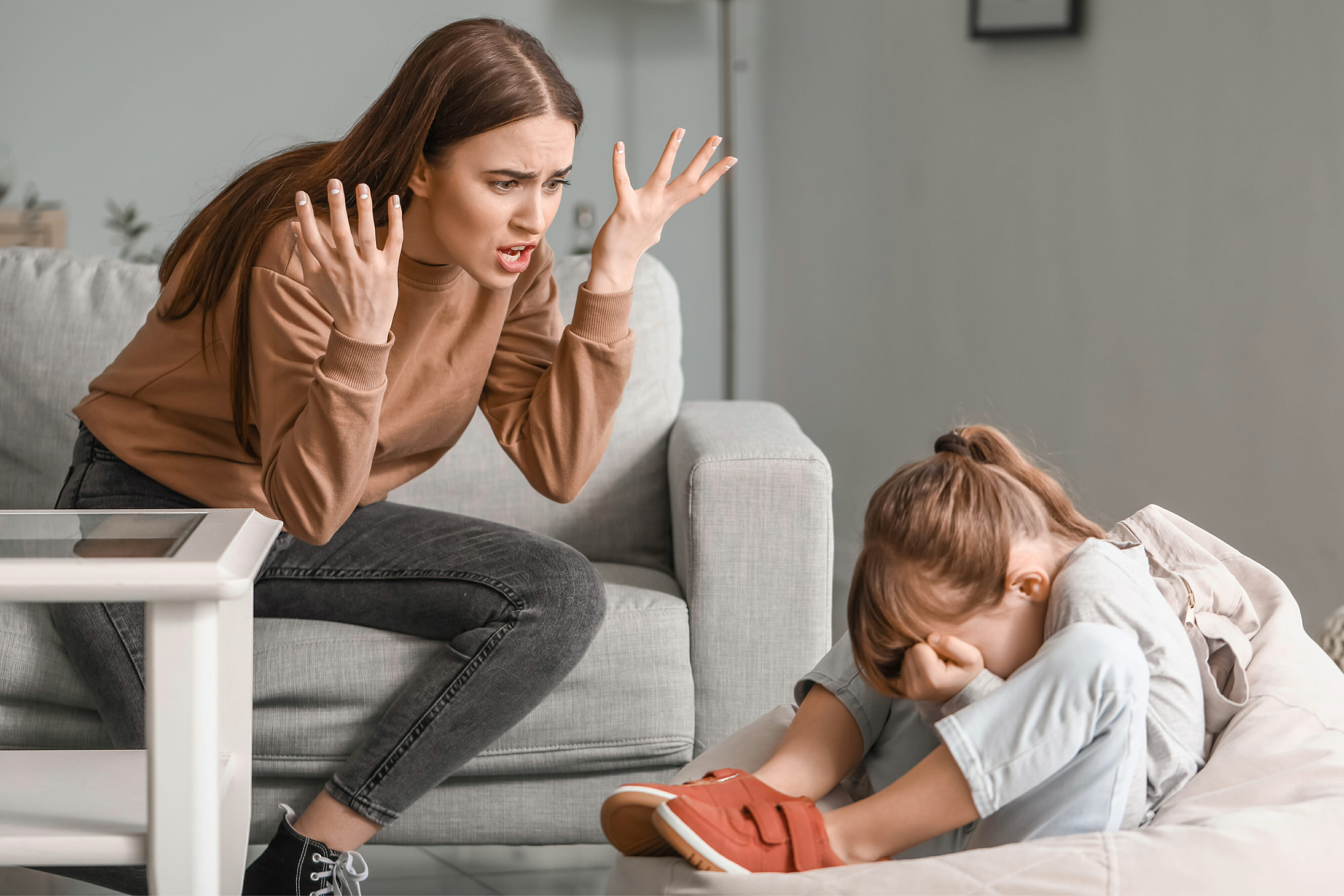 Angry mother threatening her daughter at home