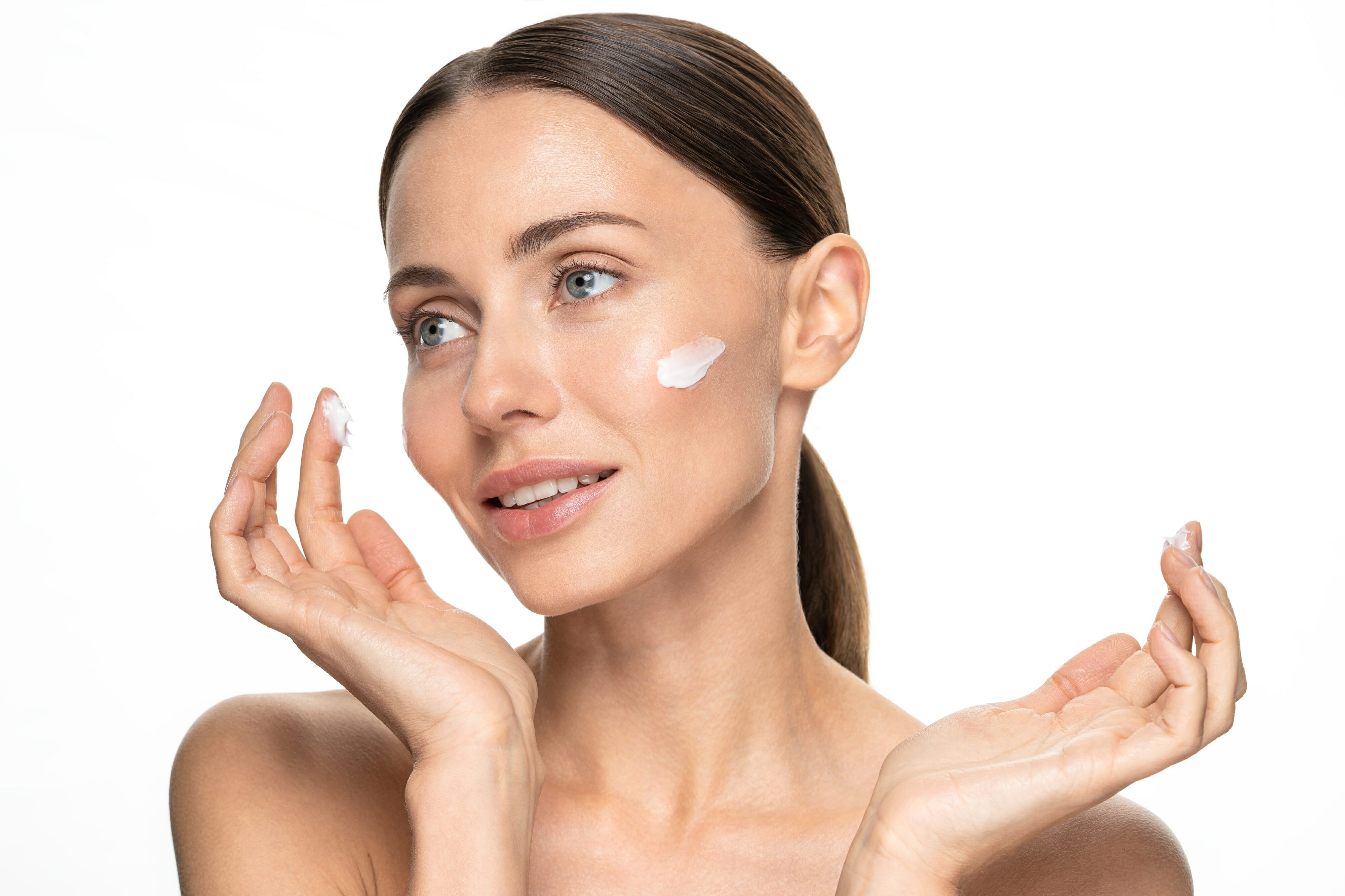 Woman applying anti-age wrinkle serum