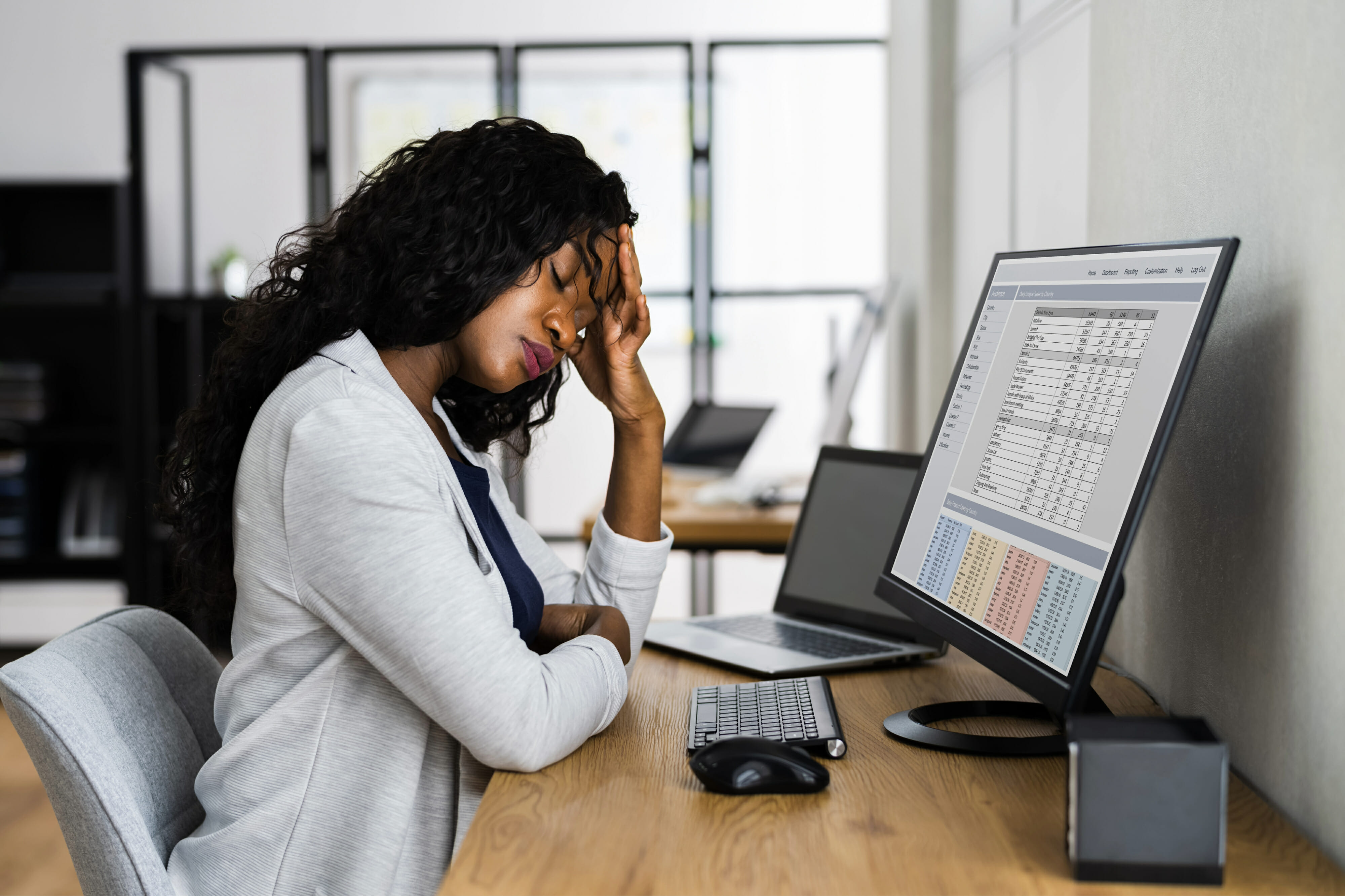 Woman stressed and tired at the office