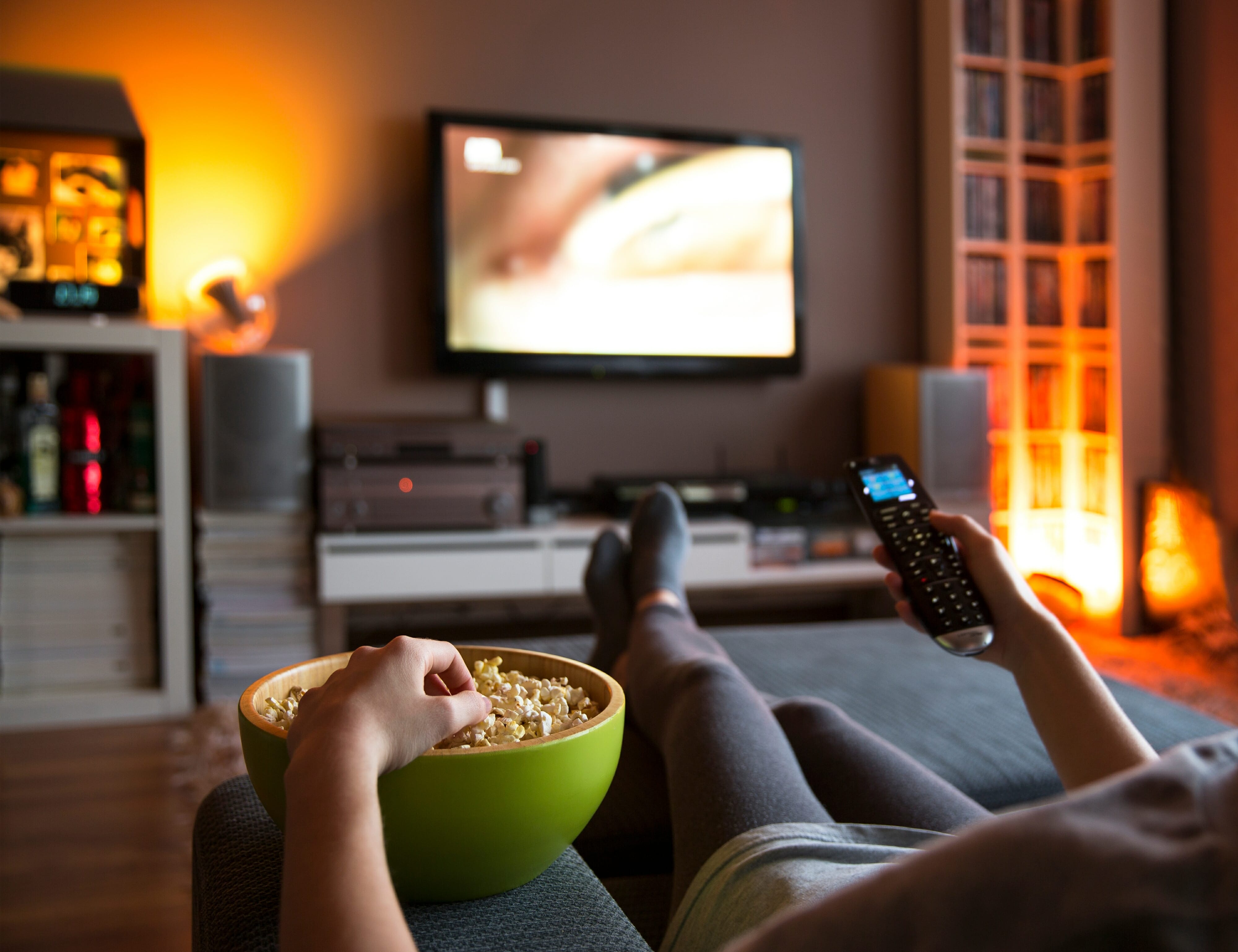 Woman watching TV and staying home too long